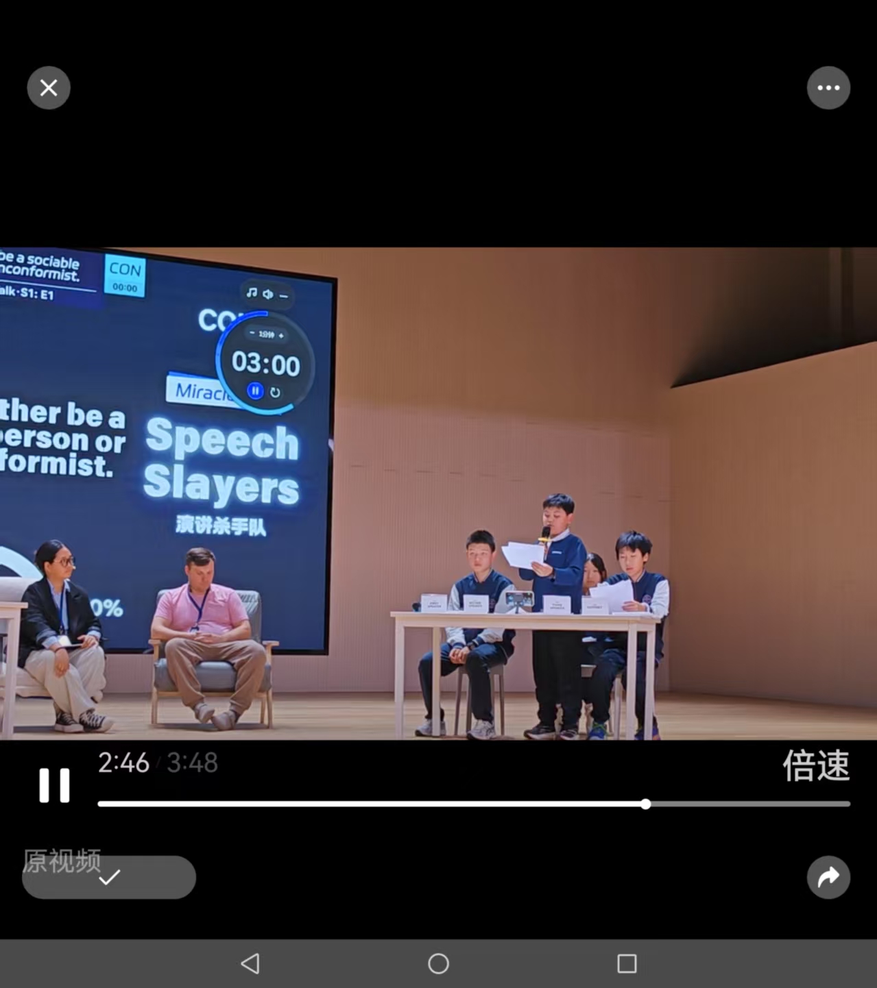 English debate team on stage